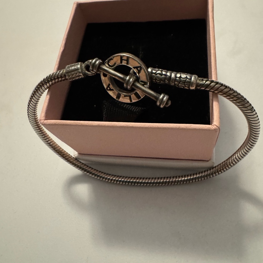 Chamilia sterling silver bracelet. New and great condition wear it alone/beads